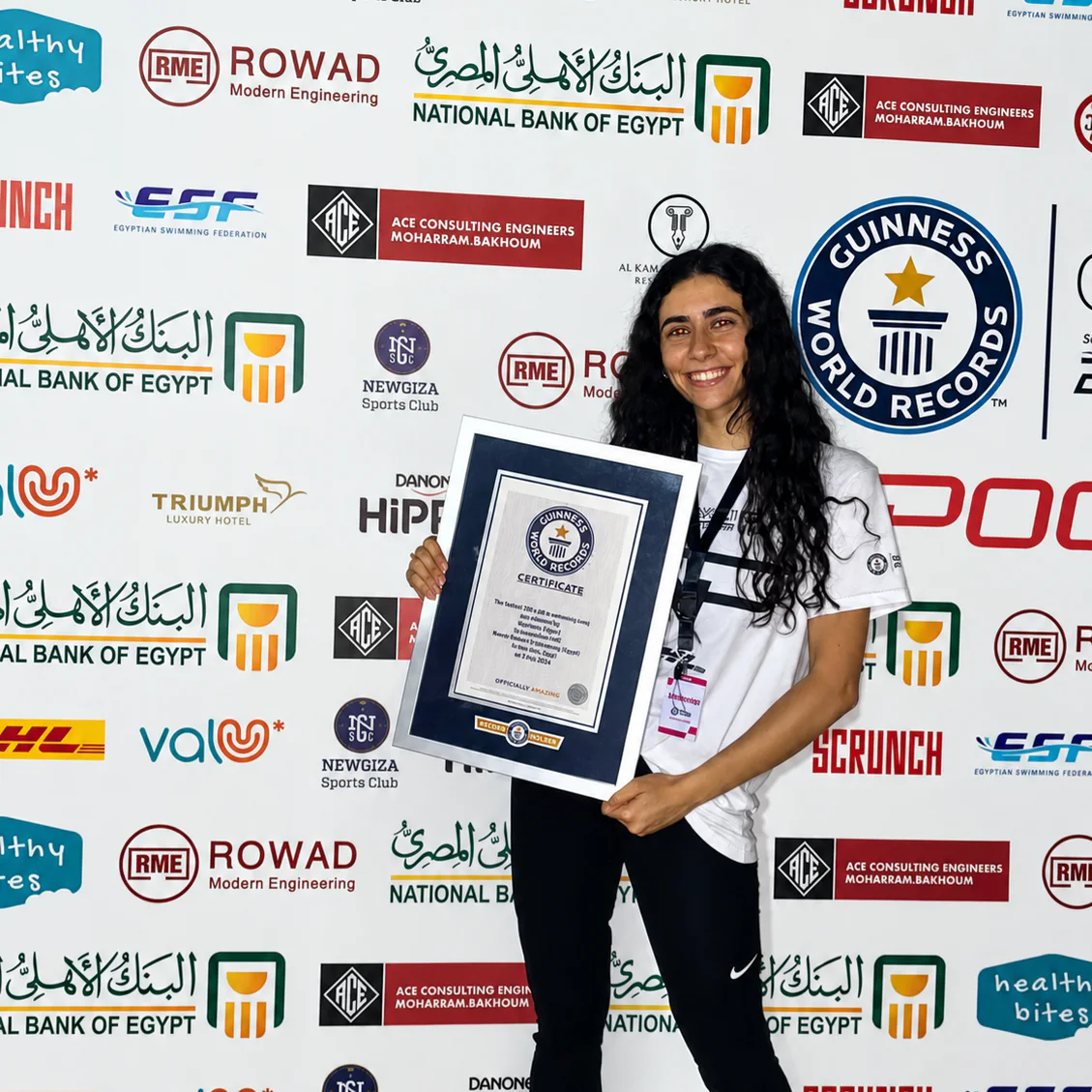 Reem Awad holding a Guinness World Records certificate